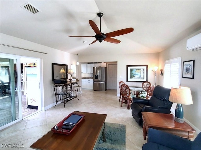 living room featuring lofted ceiling, light tile patterned floors, a wall unit AC, and ceiling fan