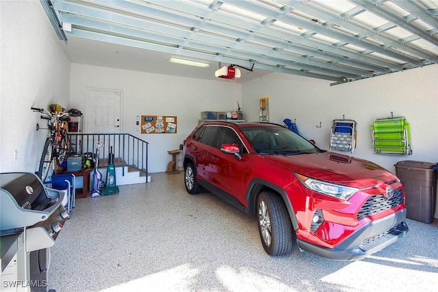 garage featuring a garage door opener