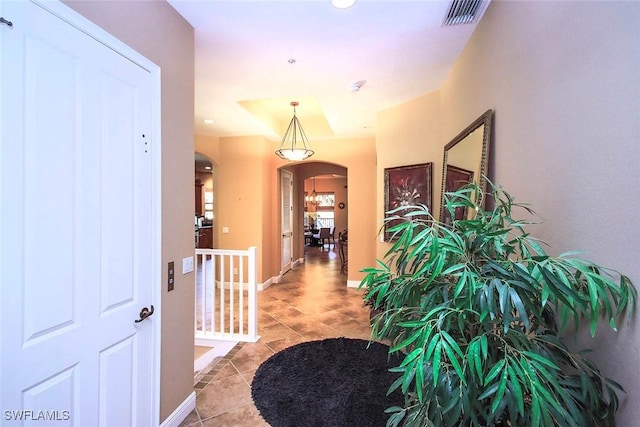 corridor with light tile patterned floors