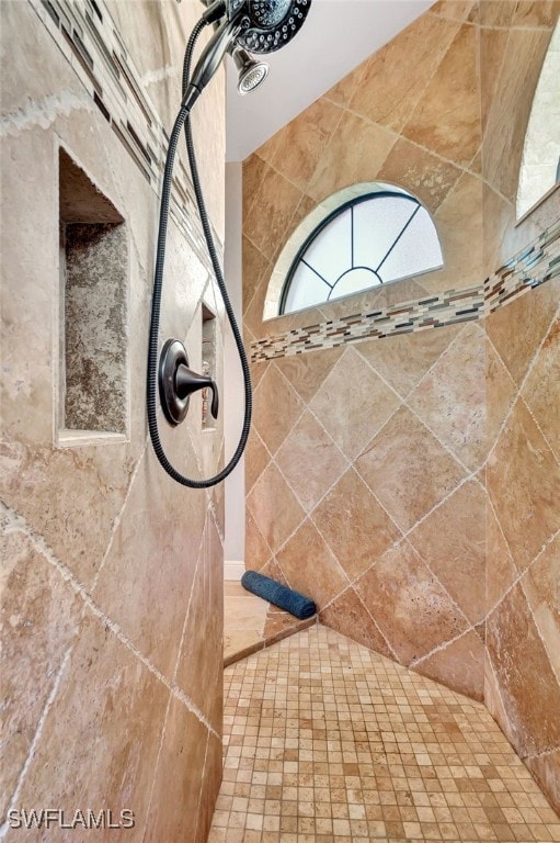 details with a tile shower