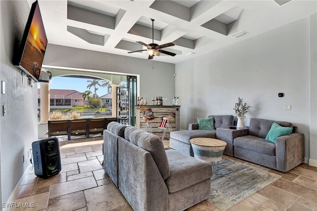 living room featuring beam ceiling, coffered ceiling, and ceiling fan