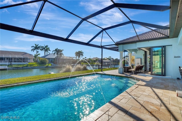 view of swimming pool with a patio, pool water feature, glass enclosure, and a water view