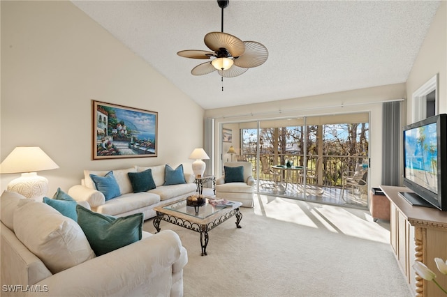 living room with ceiling fan, vaulted ceiling, light carpet, and a textured ceiling