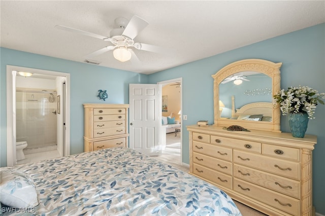 bedroom featuring ceiling fan and ensuite bathroom