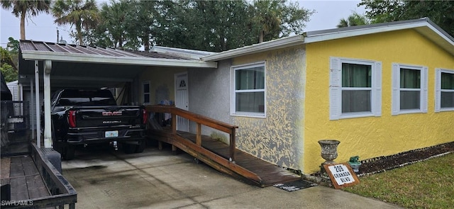 view of front of home with a carport