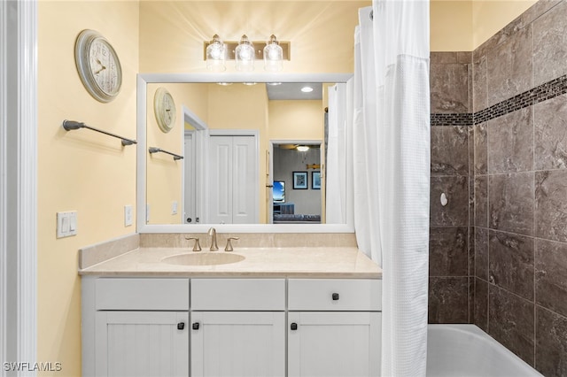 bathroom featuring vanity and shower / tub combo