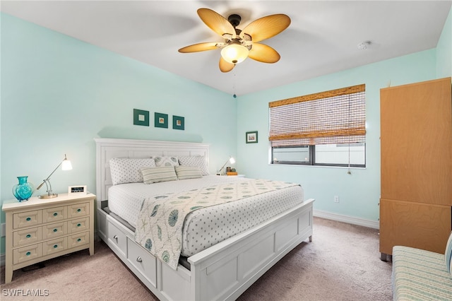 bedroom featuring light colored carpet and ceiling fan