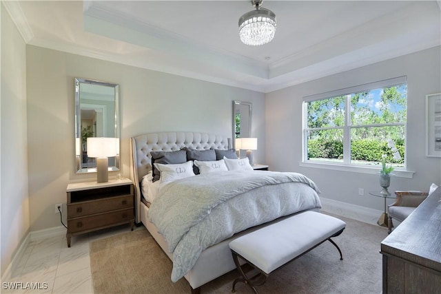 bedroom featuring baseboards, a tray ceiling, a notable chandelier, and ornamental molding