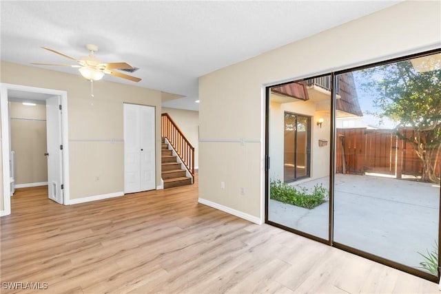 unfurnished room featuring ceiling fan and light hardwood / wood-style flooring