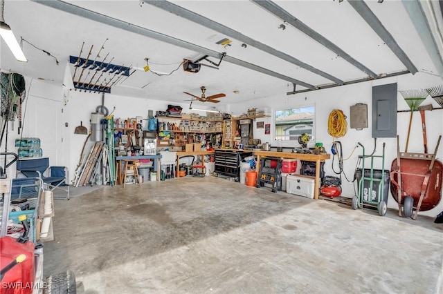 garage with a garage door opener, electric panel, and a workshop area