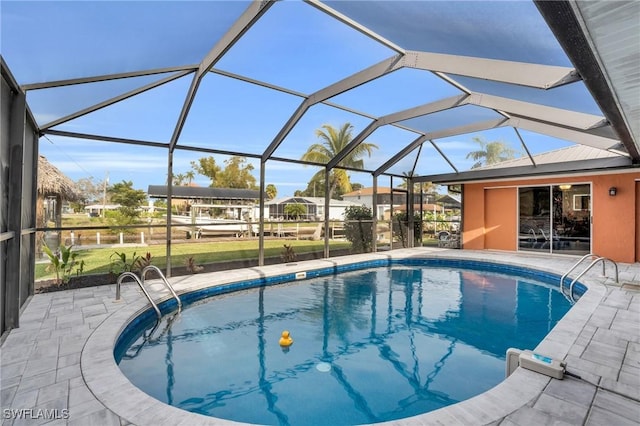 view of pool with a patio and a lanai