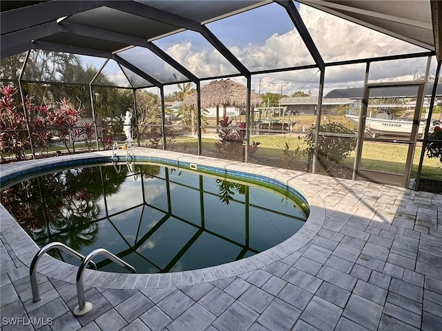 view of pool with a lanai and a patio