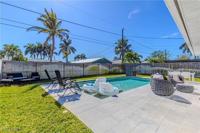 view of pool featuring a fenced in pool, a fenced backyard, a patio, and a lawn