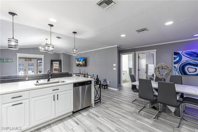 kitchen with stainless steel dishwasher, a sink, visible vents, and white cabinets