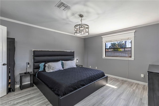 bedroom featuring wood tiled floor, visible vents, and crown molding