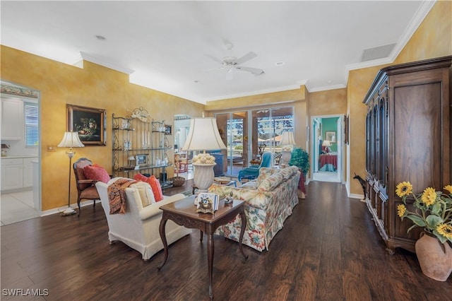 living room with ornamental molding, ceiling fan, and dark hardwood / wood-style flooring