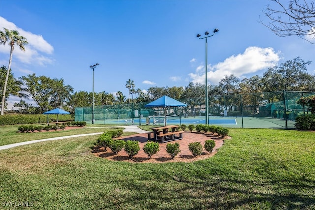 view of home's community featuring a gazebo, a yard, and tennis court