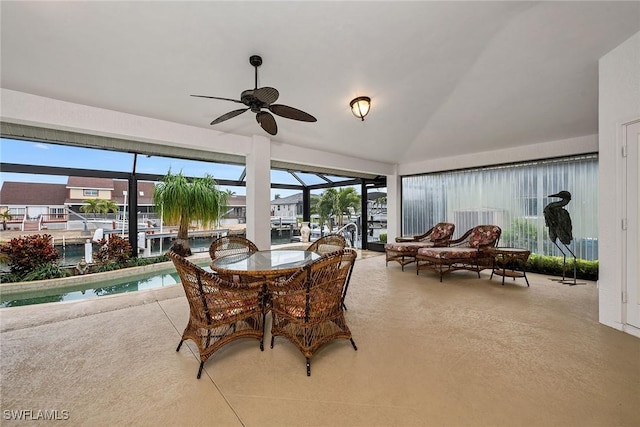 dining space with vaulted ceiling and ceiling fan