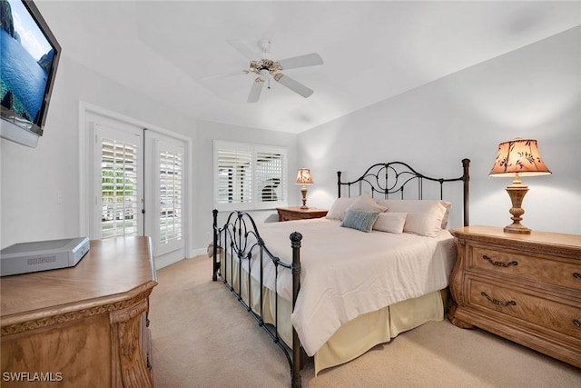 bedroom featuring ceiling fan, access to exterior, and light carpet