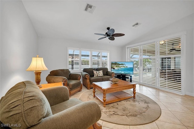 tiled living room featuring ceiling fan