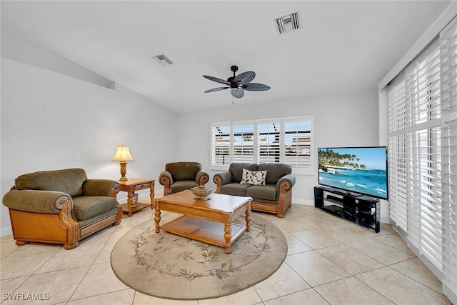 tiled living room with ceiling fan