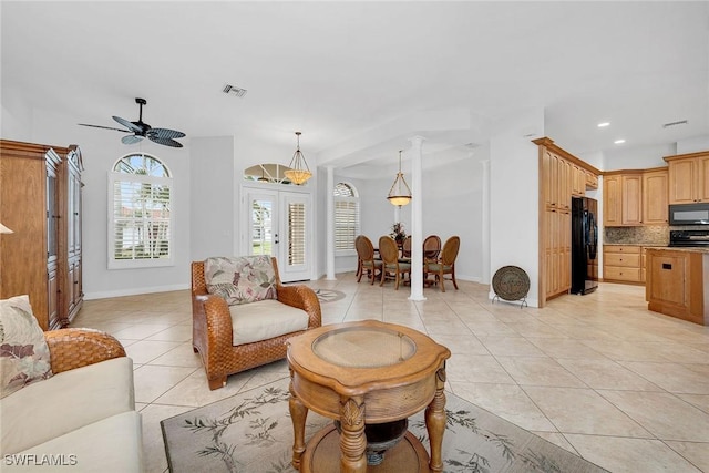 living room with light tile patterned flooring, ceiling fan, and french doors