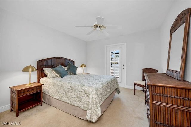 carpeted bedroom featuring ceiling fan and access to exterior