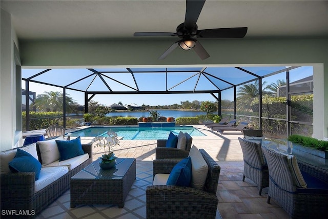 view of pool featuring a water view, ceiling fan, an outdoor living space, and glass enclosure