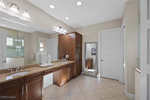 bathroom with tile patterned floors and vanity