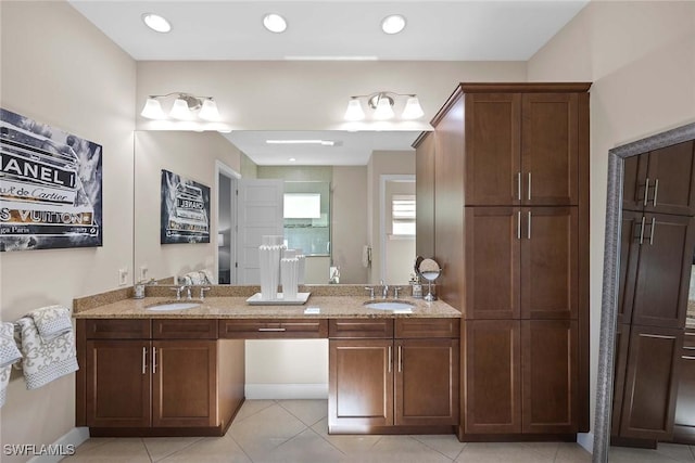 bathroom with tile patterned flooring and vanity