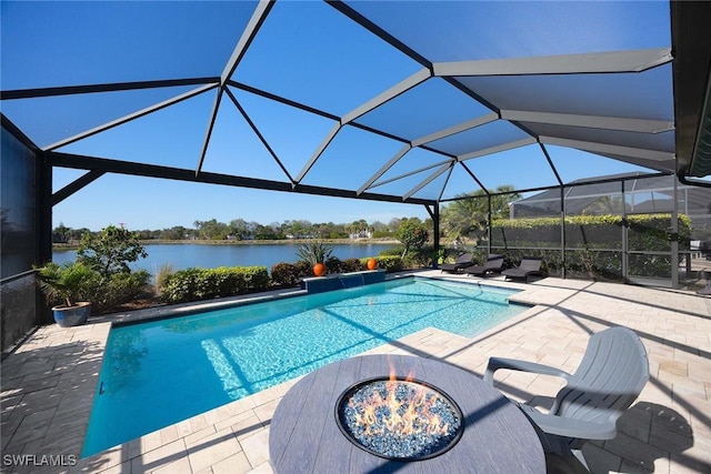 view of swimming pool with a water view, a lanai, a fire pit, and a patio