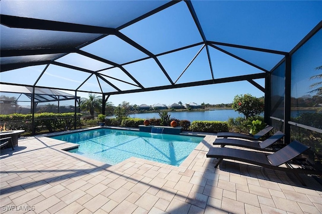 view of swimming pool with pool water feature, a patio, a water view, and glass enclosure