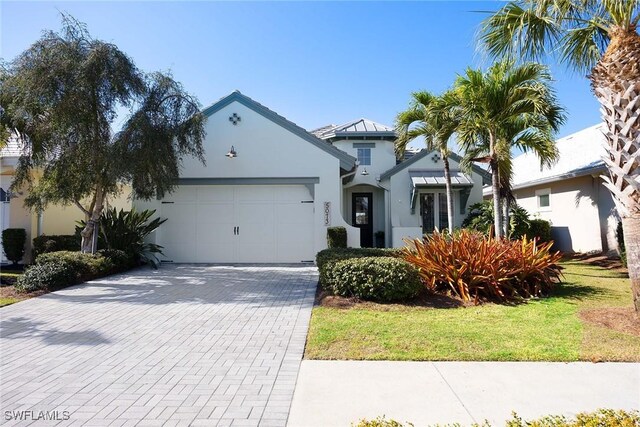 view of front facade with a garage and a front lawn