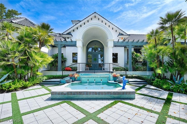 rear view of house with a pergola