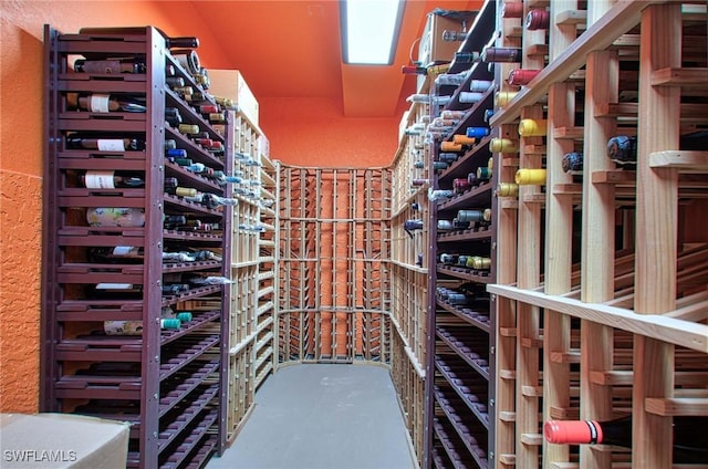 wine area featuring concrete flooring