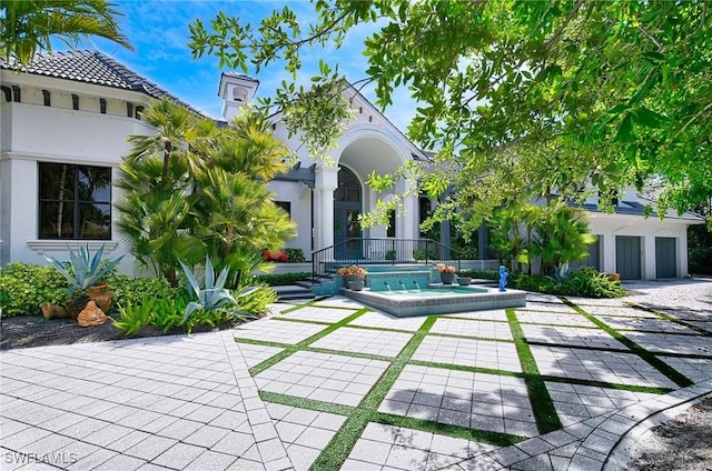 rear view of house with a patio area