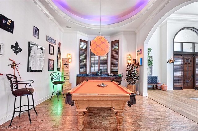 game room featuring ornamental molding, billiards, and a tray ceiling