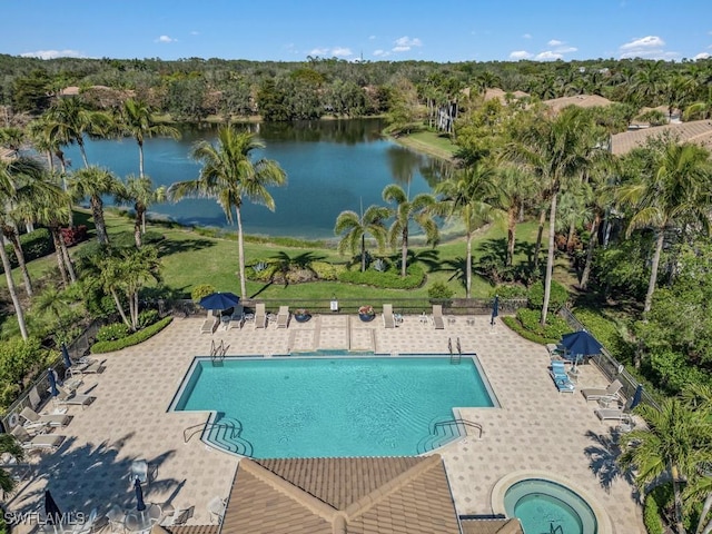 15540 Monterosso Ln Unit 202, Naples, FL 34110 - community pool featuring a patio, a water view, and fence