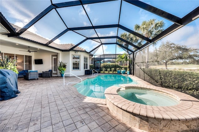 view of swimming pool with a patio, outdoor lounge area, an in ground hot tub, ceiling fan, and glass enclosure