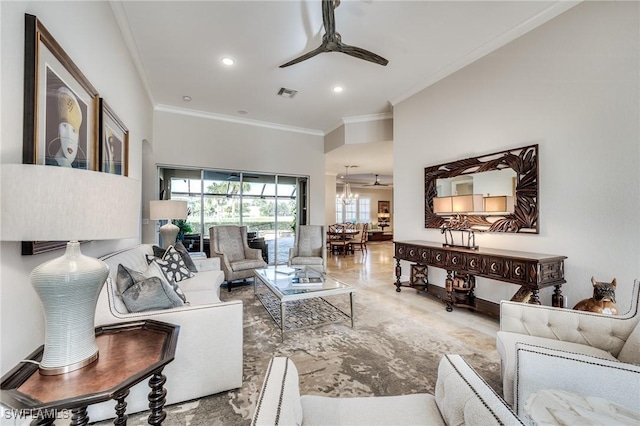 living room featuring crown molding and ceiling fan with notable chandelier