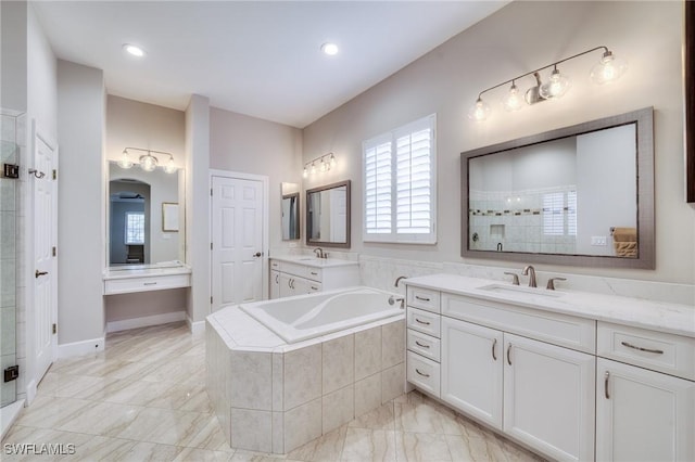 bathroom featuring vanity and shower with separate bathtub