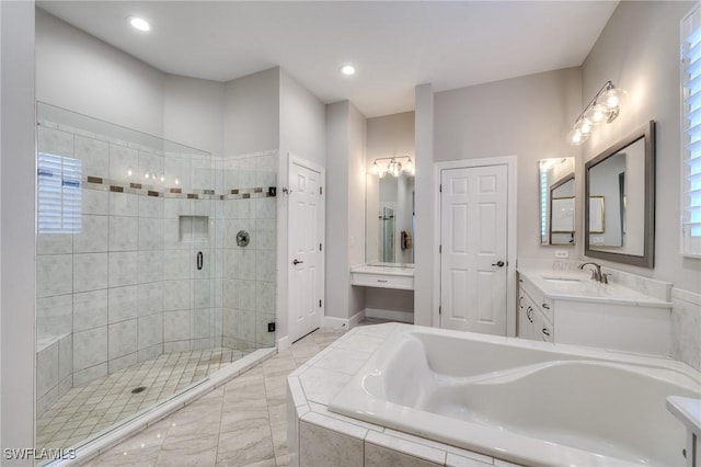 bathroom featuring vanity and shower with separate bathtub