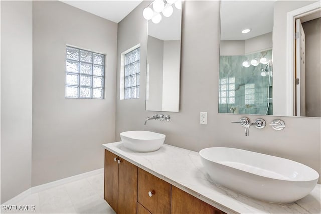 bathroom with vanity, tile patterned floors, and walk in shower