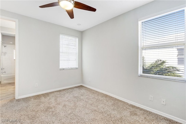 carpeted empty room with ceiling fan