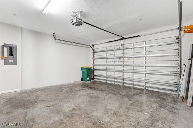 garage featuring a garage door opener and electric panel