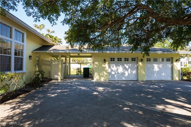 exterior space featuring a garage and a carport