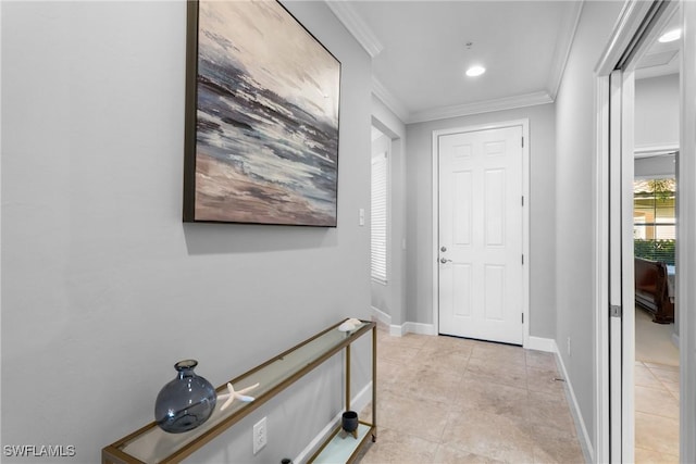 corridor featuring crown molding, light tile patterned flooring, and baseboards