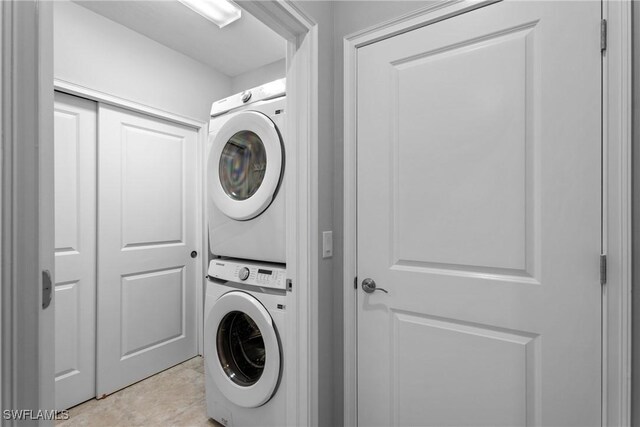 laundry room with stacked washer and clothes dryer