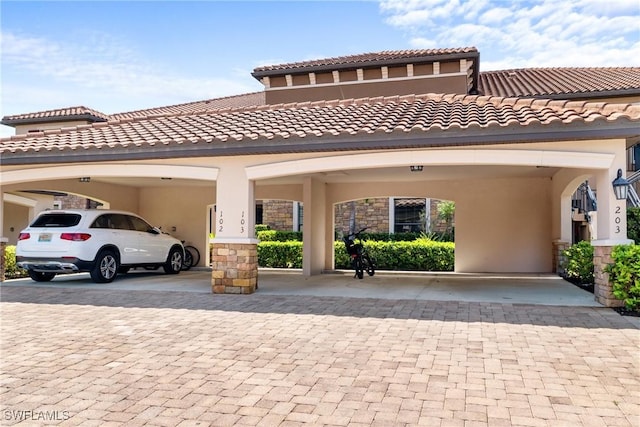 view of front of property with stucco siding and stone siding