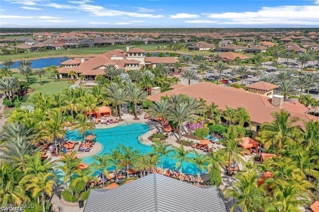 aerial perspective of suburban area featuring a pool